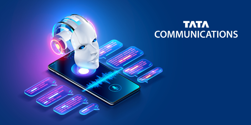 A 3D robotic head with glowing headphones hovers above a smartphone displaying a blue voice-waveform graphic. Colourful chat bubbles float around the device, symbolising AI-driven conversations. The Tata Communications logo appears on the right against a blue background